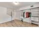 Open bedroom with laminate floors, ample closet space, and access to an en-suite bathroom at 3990 Admiral Dr, Chamblee, GA 30341