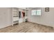 Bedroom with wood-look flooring and built in storage and natural light at 3990 Admiral Dr, Chamblee, GA 30341
