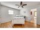 Cozy bedroom with hardwood floors, ceiling fan, and ensuite bathroom access at 3990 Admiral Dr, Chamblee, GA 30341