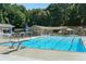 Relaxing community pool with diving board, umbrellas, and lounge chairs at 3990 Admiral Dr, Chamblee, GA 30341