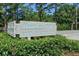 Welcoming Huntley Hills swim and tennis club sign amidst lush green landscaping at 3990 Admiral Dr, Chamblee, GA 30341