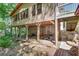 Back of home with covered area, brick columns, and stone steps at 3990 Admiral Dr, Chamblee, GA 30341