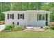Charming white brick home with black shutters and well-maintained front yard landscaping at 3990 Admiral Dr, Chamblee, GA 30341