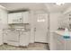 Bright kitchen features white cabinets, granite countertops, and modern appliances at 3990 Admiral Dr, Chamblee, GA 30341