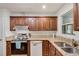 Well-equipped kitchen with stainless steel appliances, granite countertops, and wooden cabinetry at 3990 Admiral Dr, Chamblee, GA 30341
