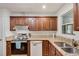 Charming kitchen features stainless steel appliances, double sinks, and wood cabinets at 3990 Admiral Dr, Chamblee, GA 30341
