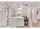 Bright laundry room featuring washer, dryer, sink, and storage shelving at 3990 Admiral Dr, Chamblee, GA 30341