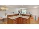 Open living room area with granite counter space and wood cabinets at 3990 Admiral Dr, Chamblee, GA 30341