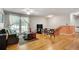 Living room with hardwood floors, lots of light, stairway, sofa and occasional chairs at 3990 Admiral Dr, Chamblee, GA 30341