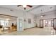 Living room with tile floors, ceiling fans, and view to a dining area, doors, and windows at 3990 Admiral Dr, Chamblee, GA 30341