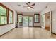 Inviting living room area features a vaulted ceiling, tile floor, and double french doors at 3990 Admiral Dr, Chamblee, GA 30341