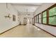 Spacious living room with large windows and tile flooring throughout at 3990 Admiral Dr, Chamblee, GA 30341