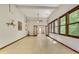 A bright living room with tile floors, multiple windows, and an open layout at 3990 Admiral Dr, Chamblee, GA 30341