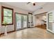 Living room with tile floors and windows with a view of the deck at 3990 Admiral Dr, Chamblee, GA 30341