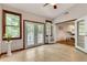 Inviting living room area features a vaulted ceiling, tile floor, and double french doors at 3990 Admiral Dr, Chamblee, GA 30341