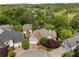 Aerial shot showcases the lovely home nestled amongst mature trees in a serene, wooded neighborhood at 4223 Wieuca Overlook Ne, Atlanta, GA 30342