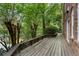 Wooden back deck with railing overlooking lush greenery, offering a private outdoor space at 4223 Wieuca Overlook Ne, Atlanta, GA 30342