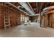 Unfinished basement featuring exposed ductwork and a walkout to the backyard at 4223 Wieuca Overlook Ne, Atlanta, GA 30342