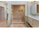 Bathroom featuring an expansive walk-in shower and marble vanity at 4223 Wieuca Overlook Ne, Atlanta, GA 30342