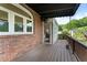 Inviting outdoor deck with wood flooring, brick exterior, and a serene view, perfect for relaxing outdoors at 4223 Wieuca Overlook Ne, Atlanta, GA 30342