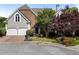 Charming two-story home featuring a brick and stucco exterior, two-car garage, and beautiful landscaping at 4223 Wieuca Overlook Ne, Atlanta, GA 30342