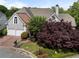Attractive two-story home with a brick and stucco front, arched window, a two-car garage, and landscaped yard at 4223 Wieuca Overlook Ne, Atlanta, GA 30342
