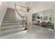 Grand foyer with a winding staircase, marble flooring, and views into the living room and a soaring ceiling at 4223 Wieuca Overlook Ne, Atlanta, GA 30342