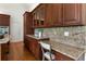 The kitchen boasts granite countertops and wooden cabinets, complete with a built-in desk area at 4223 Wieuca Overlook Ne, Atlanta, GA 30342