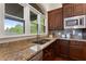 This kitchen features a large window over the sink and granite countertops at 4223 Wieuca Overlook Ne, Atlanta, GA 30342