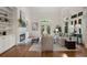 Bright living room with hardwood floors, built-in bookshelves, and a fireplace with a white mantel at 4223 Wieuca Overlook Ne, Atlanta, GA 30342