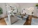 Open-concept living room with hardwood floors and large windows at 4223 Wieuca Overlook Ne, Atlanta, GA 30342