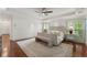 Serene main bedroom boasts hardwood floors, a bench seat, and ample natural light, perfect for relaxation at 4223 Wieuca Overlook Ne, Atlanta, GA 30342