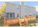 Rear exterior view of the house with a deck and a fenced yard at 6980 Talkeetna Sw Ct, Atlanta, GA 30331