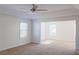 Spacious bedroom with new carpet, fan, and ample light at 6980 Talkeetna Sw Ct, Atlanta, GA 30331