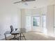Bright, carpeted bedroom with a corner window that fills the room with natural light, with a desk at 6980 Talkeetna Sw Ct, Atlanta, GA 30331