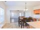 Bright dining area features tile flooring, a wooden table, and natural light from a window at 6980 Talkeetna Sw Ct, Atlanta, GA 30331