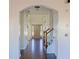 Elegant foyer boasts hardwood floors, an arched entryway, and a view of the front door and stairway at 6980 Talkeetna Sw Ct, Atlanta, GA 30331