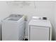 Bright laundry room featuring a modern washer and dryer set for convenient laundry days at 6980 Talkeetna Sw Ct, Atlanta, GA 30331