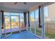 Enclosed patio/porch area with an accessible outdoor deck and open backyard at 6980 Talkeetna Sw Ct, Atlanta, GA 30331