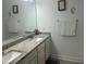 Bathroom features double granite sink vanity and decor on the wall at 82 Hinton Farm Way, Dacula, GA 30019