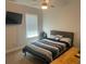 Comfortable bedroom featuring a large window and ample sunlight at 82 Hinton Farm Way, Dacula, GA 30019