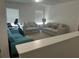 Comfortable living room features neutral walls, plush couches, and natural light from the window at 82 Hinton Farm Way, Dacula, GA 30019