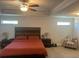 Relaxing main bedroom boasts tray ceilings, ceiling fan and ample space for sleep and rest at 82 Hinton Farm Way, Dacula, GA 30019