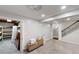 Basement with access to the stairs with iron railing, carpeted floor and storage in the adjacent room at 9680 Ephesus Church Rd, Villa Rica, GA 30180