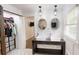 Bathroom featuring dual sinks, patterned tile floor, with view into shower at 9680 Ephesus Church Rd, Villa Rica, GA 30180
