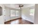 Bedroom with hardwood floors, paneled ceiling, and lots of natural light from two windows at 9680 Ephesus Church Rd, Villa Rica, GA 30180