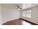 Bedroom with hardwood floors, paneled ceiling, and lots of natural light from windows at 9680 Ephesus Church Rd, Villa Rica, GA 30180