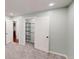 Carpeted bedroom with a built-in wardrobe and access to other rooms at 9680 Ephesus Church Rd, Villa Rica, GA 30180