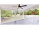 Spacious covered deck with a ceiling fan overlooking the backyard at 9680 Ephesus Church Rd, Villa Rica, GA 30180