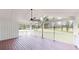 Covered patio featuring dark wood flooring, bright ceiling, and fan at 9680 Ephesus Church Rd, Villa Rica, GA 30180